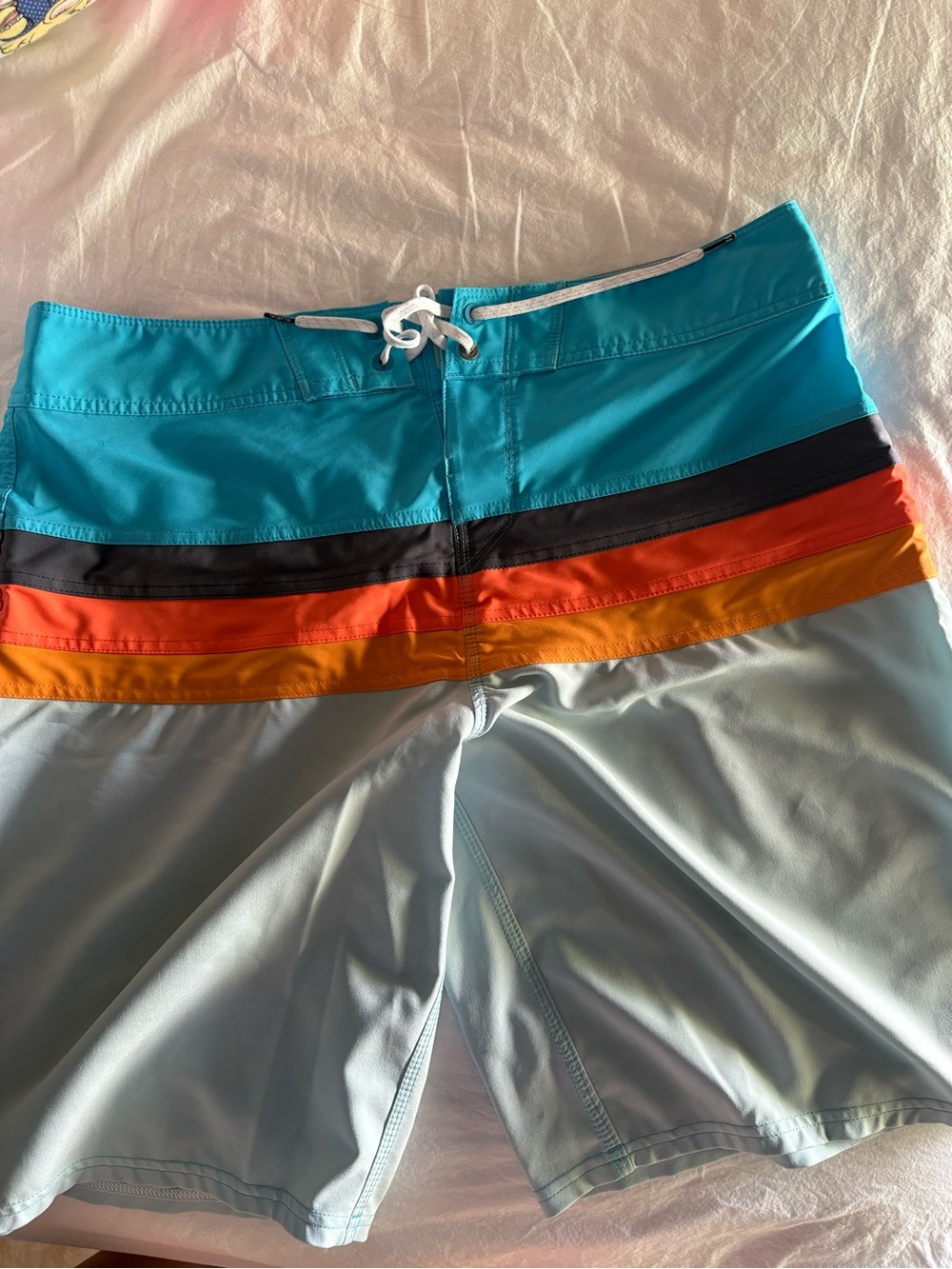 Billabong Turquoise Board Shorts with Black, Orange and Yellow Stripes